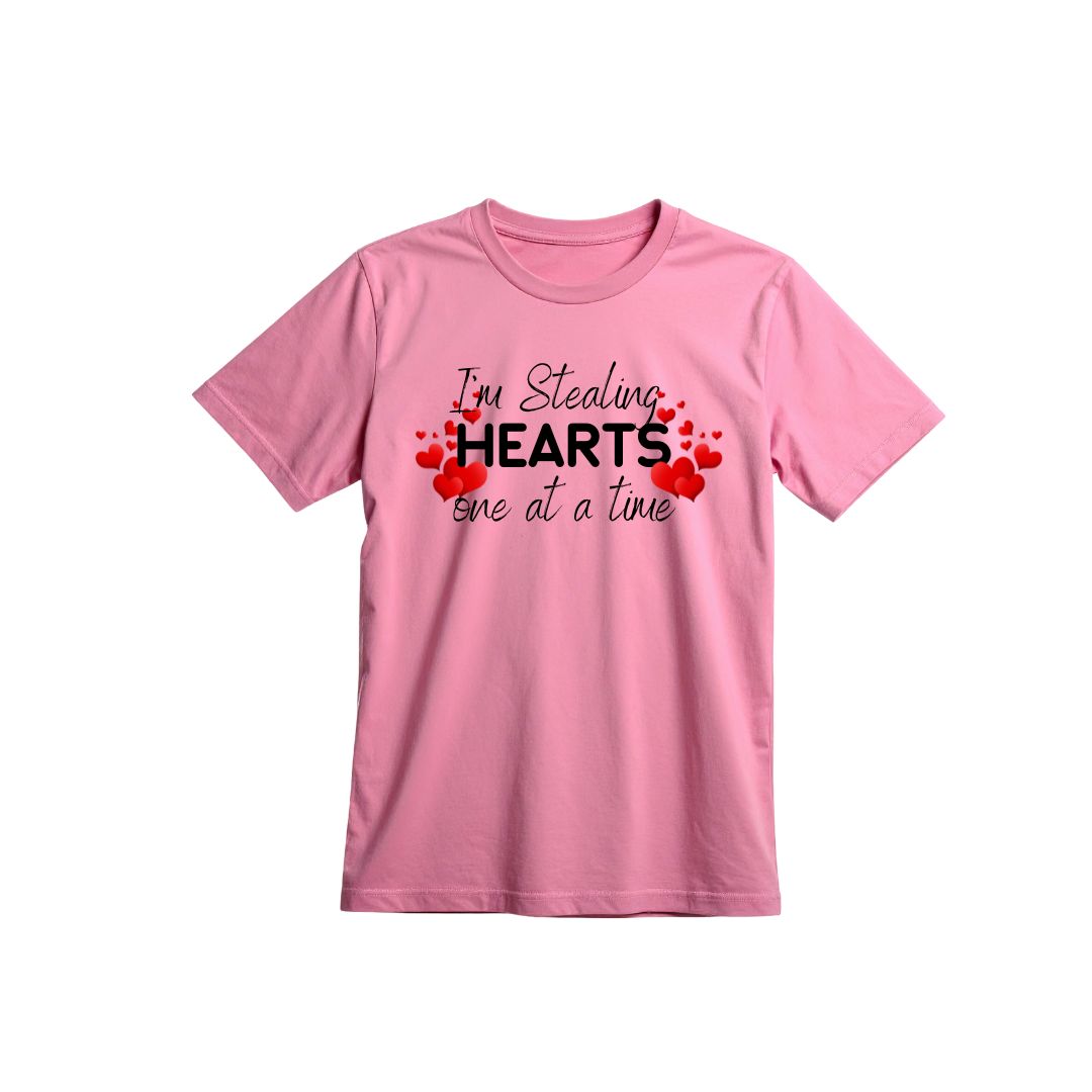 Pink t-shirt with text 'I'm Stealing Hearts one at a time' on a white background