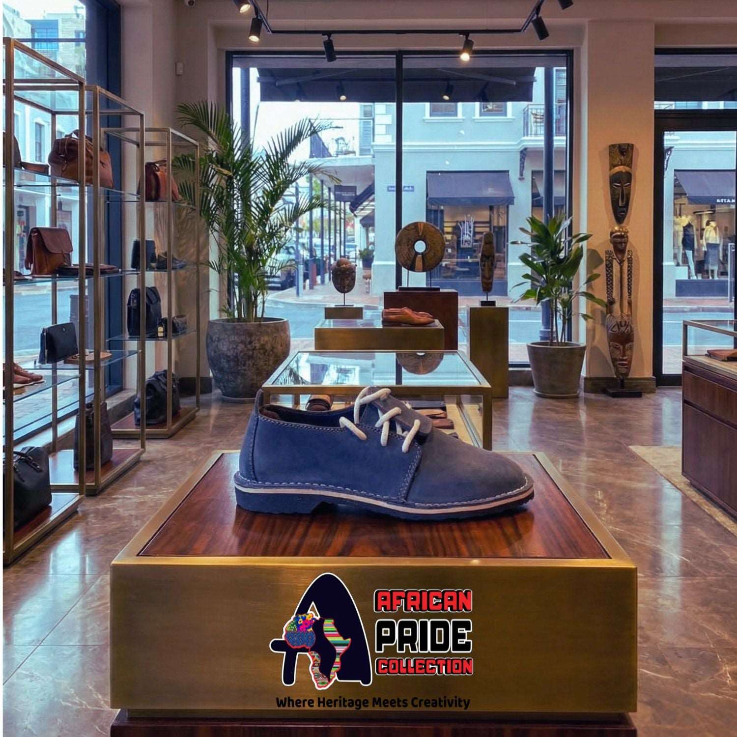 Blue shoe on a wooden display box with 'African Pride Collection' logo in a store setting.