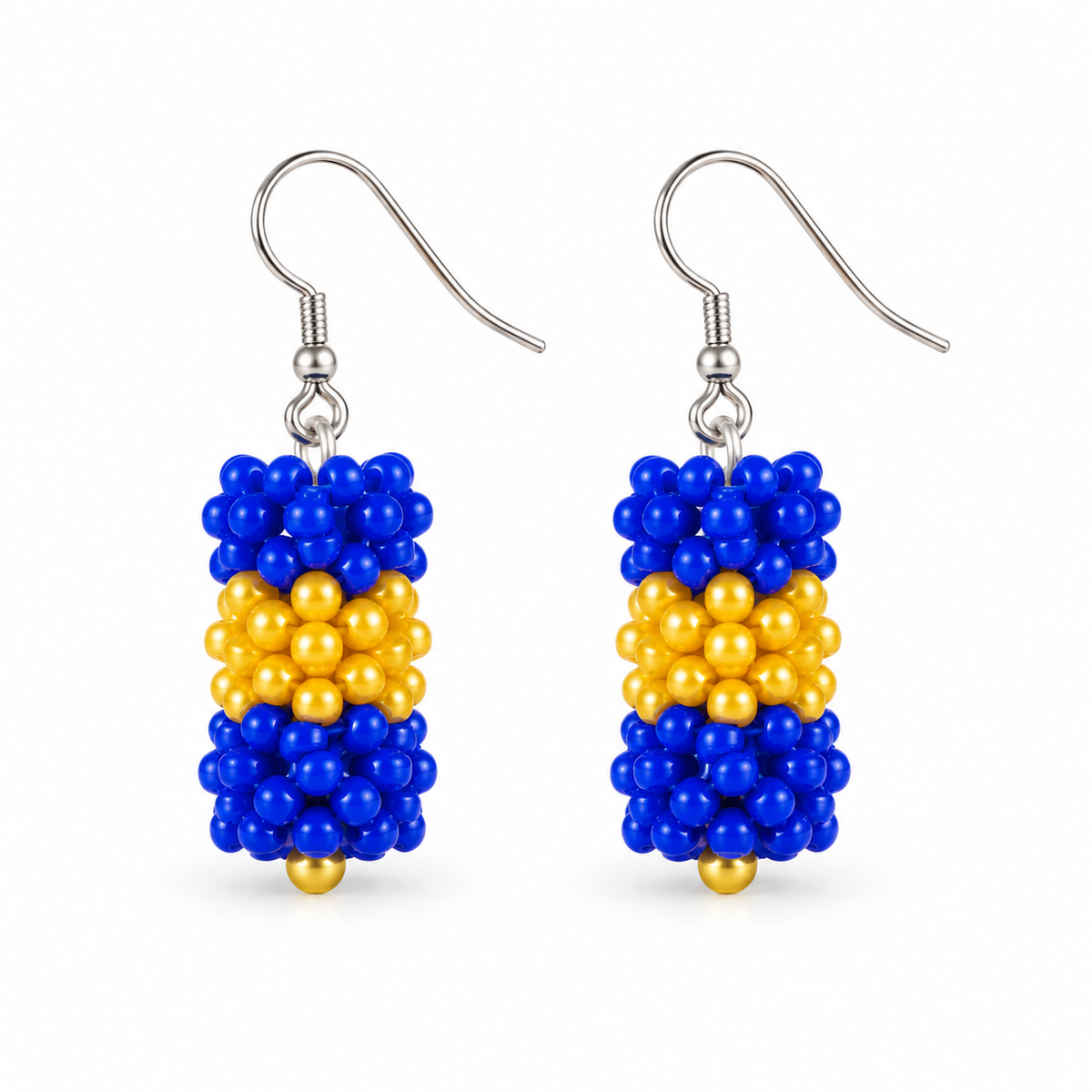 Short Blue & Gold plastic snowflake bead earrings on white background