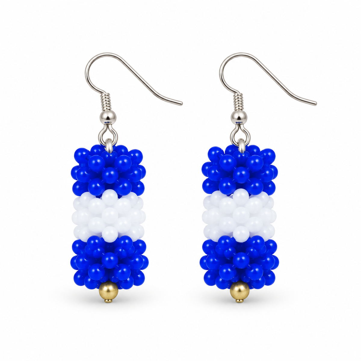 Short Blue & White plastic snowflake bead earrings on white background