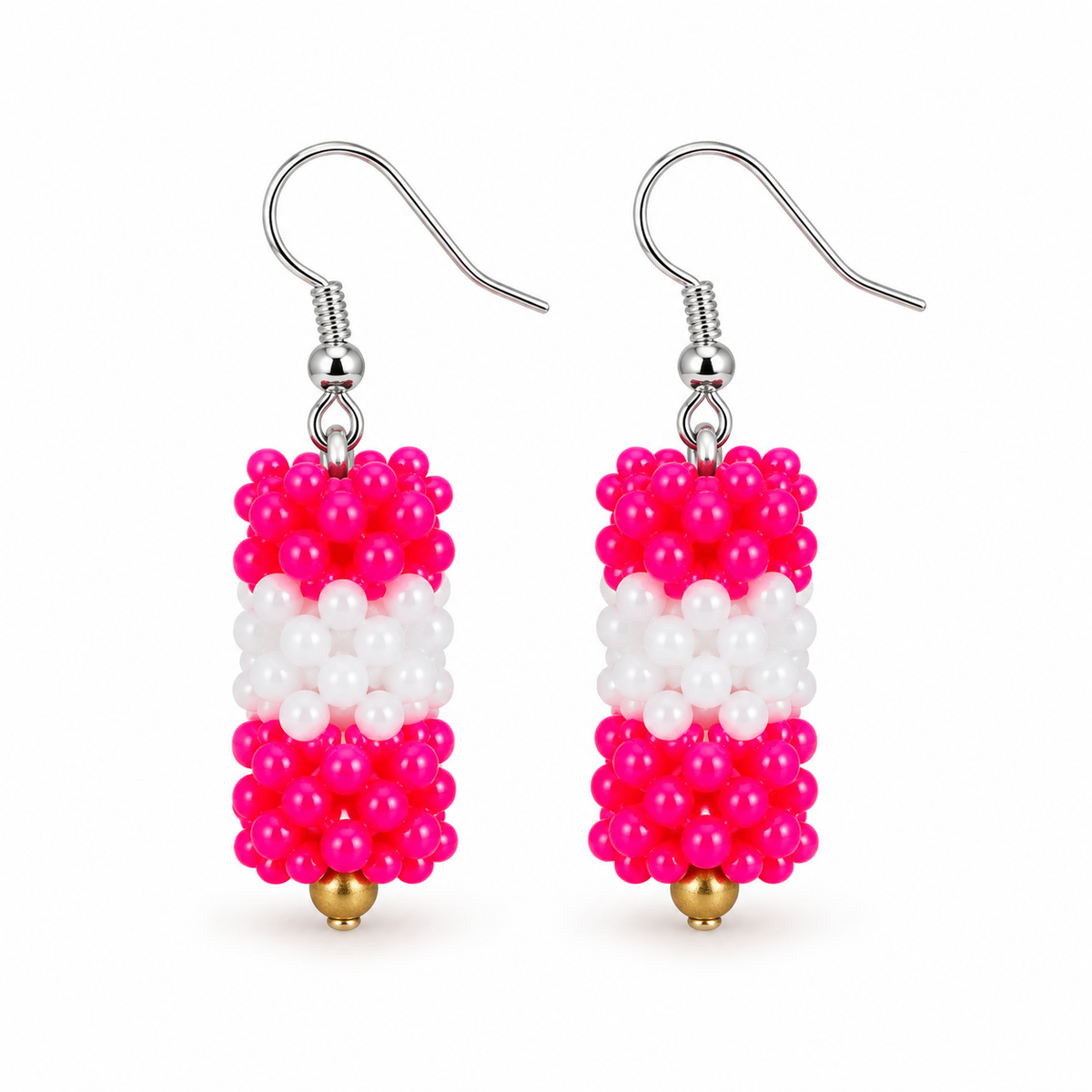 Short Pink & White plastic snowflake bead earrings on white background